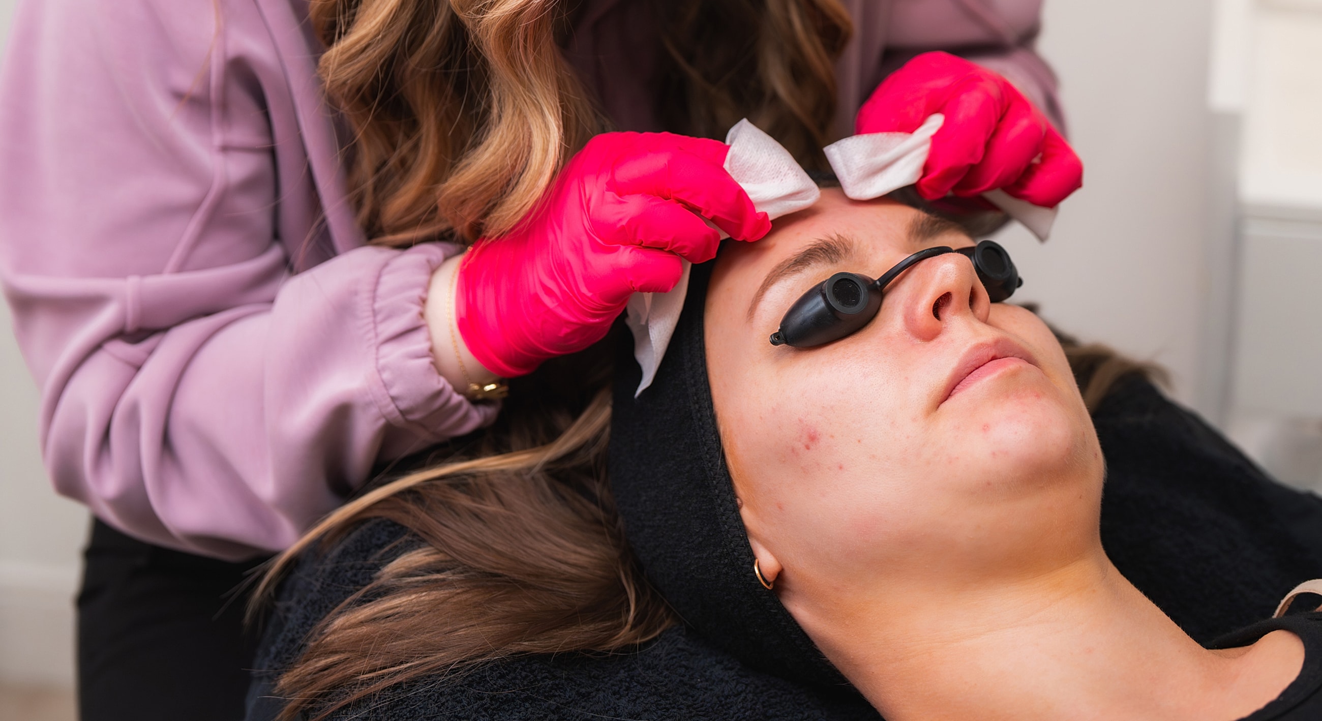Smiling woman resting with hand on her head